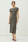 woman wearing a dark grey short sleeve ribbed midi dress and black heeled sandals