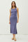 woman wearing a purple ribbed midi dress with a side slit and sandals