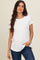 woman wearing a white short sleeve t-shirt with a relaxed fit and a pocket, paired with blue jeans