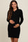 woman wearing a black ribbed maternity dress with buttons and a visible baby bump