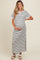 woman wearing a black and white striped maternity maxi dress with short sleeves and a visible baby bump