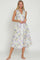 woman wearing a sleeveless lavender floral midi dress with a collared neckline and button details