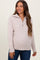 woman wearing a light pink knitted maternity pullover sweater with a zip-up collar and long sleeves