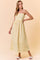 woman wearing a yellow and white striped maxi dress with thin straps and a gathered waist