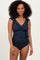 woman wearing a navy blue ruffled one-piece swimsuit with a v-neck and cinched waist