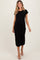 woman wearing a black short sleeve maternity dress and showing her baby bump while walking