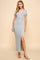 woman wearing a gray short sleeve maxi dress with a side slit and scoop neckline
