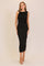 woman wearing a black ribbed midi dress with a fitted silhouette and one shoulder detail