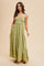 woman wearing a green tiered maxi dress with adjustable straps and floral embroidery details