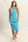 woman wearing a ribbed turquoise midi dress with a sleeveless design and a fitted silhouette