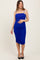 woman wearing a royal blue maternity bodycon dress with ruched detailing and a visible baby bump