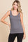 woman wearing a gray ribbed tank top paired with black leggings