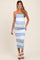 woman wearing a blue and white striped maternity dress with a fitted bodice and a flowing skirt, showing her baby bump