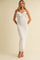 woman wearing a white ribbed maxi dress with ruffles and spaghetti straps