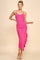 woman wearing a pink midi dress with spaghetti straps and a ruched side detail