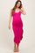 woman wearing a hot pink maternity dress with a ruffle hem and a fitted silhouette, showcasing her baby bump