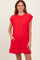 woman wearing a bright red sleeveless dress with embellished shoulder details and side pockets