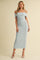 woman wearing a light blue ribbed off-shoulder midi dress with thin straps and a fitted silhouette