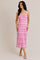 woman wearing a strapless pink midi dress with textured ruffles and a fitted silhouette