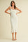 woman wearing a cream knitted midi dress with ruffle detail and spaghetti straps
