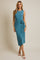 woman wearing a teal sleeveless midi dress with a wrap detail and tie at the waist