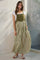 woman wearing a green and white striped maxi dress with a fitted bodice and gathered skirt