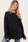 woman wearing a black long sleeve maternity sweatshirt with a relaxed fit and visible baby bump