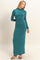 woman wearing a teal long sleeve bodycon maxi dress with a high neckline and a slim fit