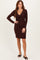 woman wearing a burgundy long sleeve wrap dress with a tie detail at the waist