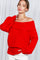 woman wearing a red off-shoulder sweater with ribbed details and long sleeves