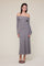 woman wearing a gray off-the-shoulder ribbed knit maxi dress with long sleeves and a fitted silhouette