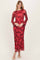 woman wearing a red floral long sleeve dress with bell sleeves and a fitted silhouette