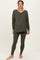woman wearing an olive green maternity loungewear set with a v-neck long sleeve top and matching leggings, showing baby bump