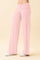 woman wearing light pink wide-leg lounge pants with an elastic waistband