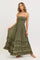 woman wearing a sage green strapless maxi dress with ruffle tiers and a smocked bodice