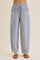 woman wearing blue and white striped loose-fitting pants with an elastic waistband and side pockets