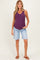 woman wearing a purple maternity tank top and denim bermuda shorts, showing her baby bump