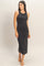 woman wearing a black sleeveless midi dress with a fitted silhouette and smooth fabric texture