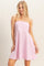 woman wearing a strapless pink and white striped dress with a flared skirt