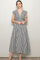 woman wearing a black and white gingham maxi dress with cap sleeves and a twisted front detail