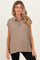woman wearing a taupe maternity polo style top with short sleeves and a button placket
