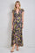 woman wearing a black floral maxi dress with short flutter sleeves and a deep v-neckline