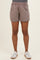 woman wearing light brown maternity shorts with an elastic waistband and side pockets