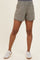 woman wearing light gray maternity shorts with an elastic waistband and a relaxed fit