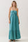 woman wearing a teal maxi dress with spaghetti straps and a ruffled bodice detail