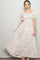 woman wearing a light pink floral maxi dress with puff sleeves and a fitted bodice
