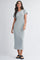woman wearing a light gray short sleeve midi dress with a relaxed fit and scoop neckline