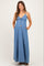 woman wearing a light blue maternity maxi dress with adjustable spaghetti straps and pockets