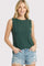 woman wearing a dark green sleeveless top and light blue distressed denim shorts