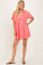 woman wearing a coral short sleeve dress with a v-neck and gathered waistline